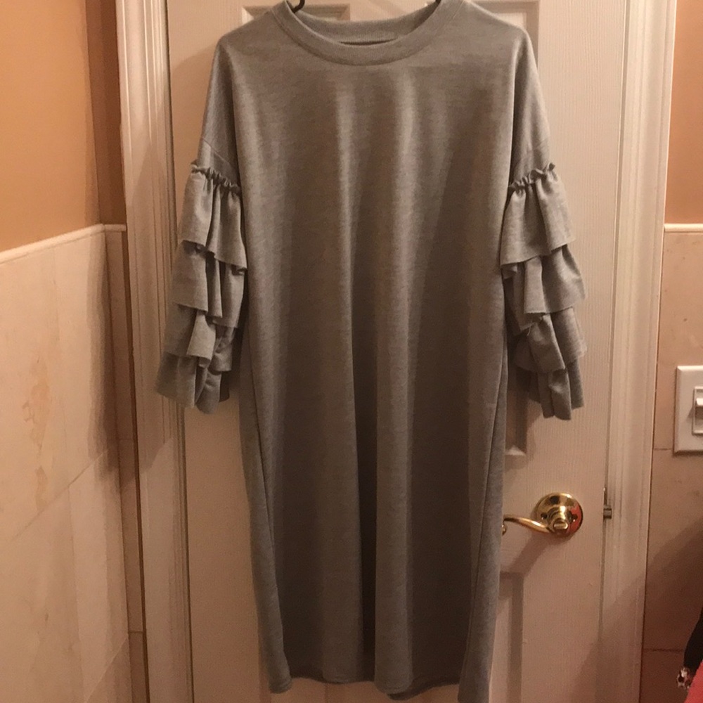 Chic knee length dress with ruffle arms!